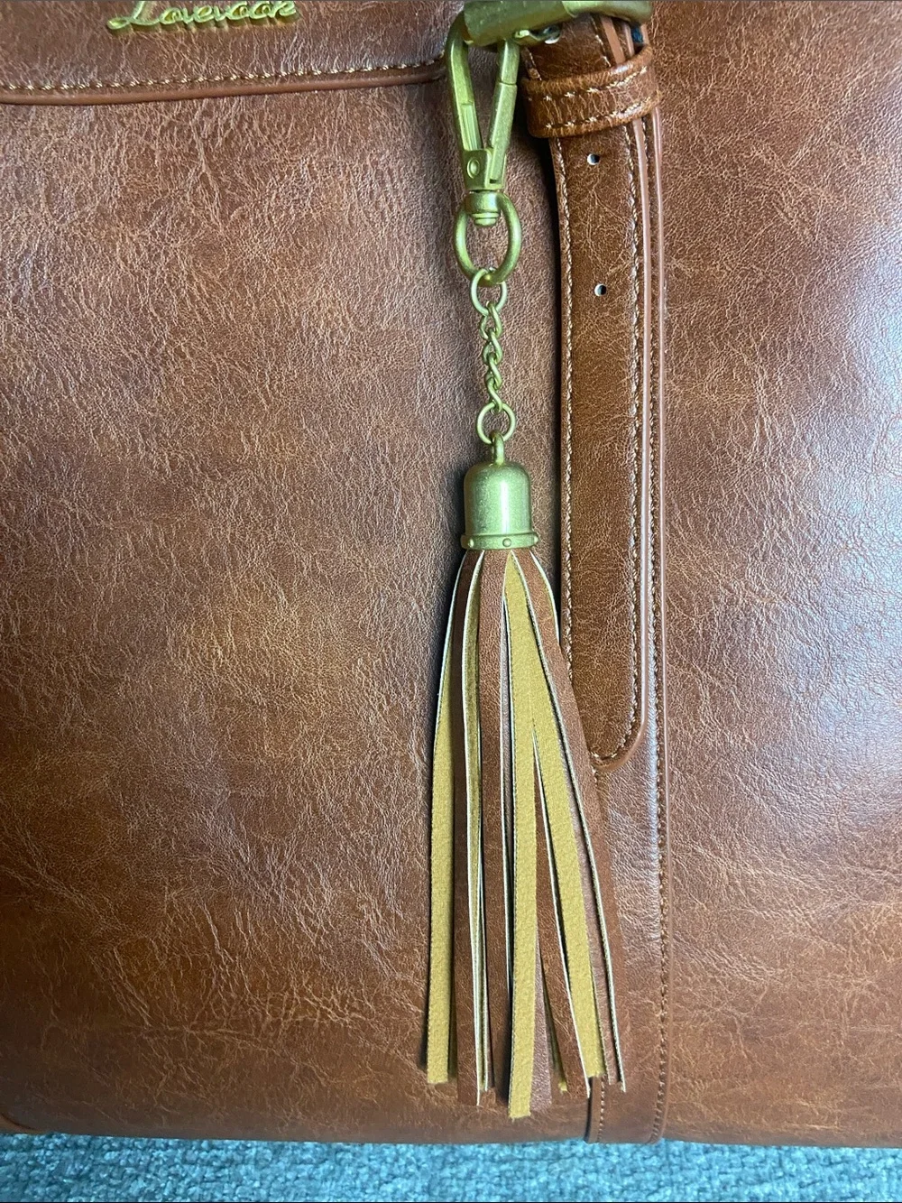 Leather-Textured Tan Tote with Tassel Accent for laptop work
